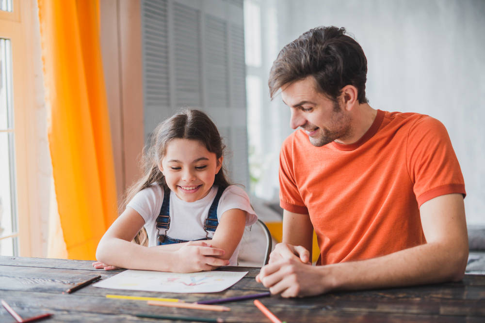 Father painting with daughter on fathers day