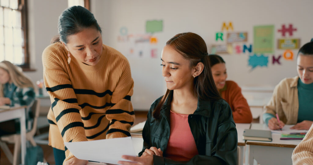 2P Blog1 teacher-test-education-with-girl-classroom-learning-entrance-exam-scholarship-helping-knowledge-future-with-student-high-school-solution-studying-problem-solving