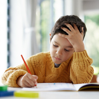 test anxiety Child drawing or boy writing homework on notebook in kindergarten education sq